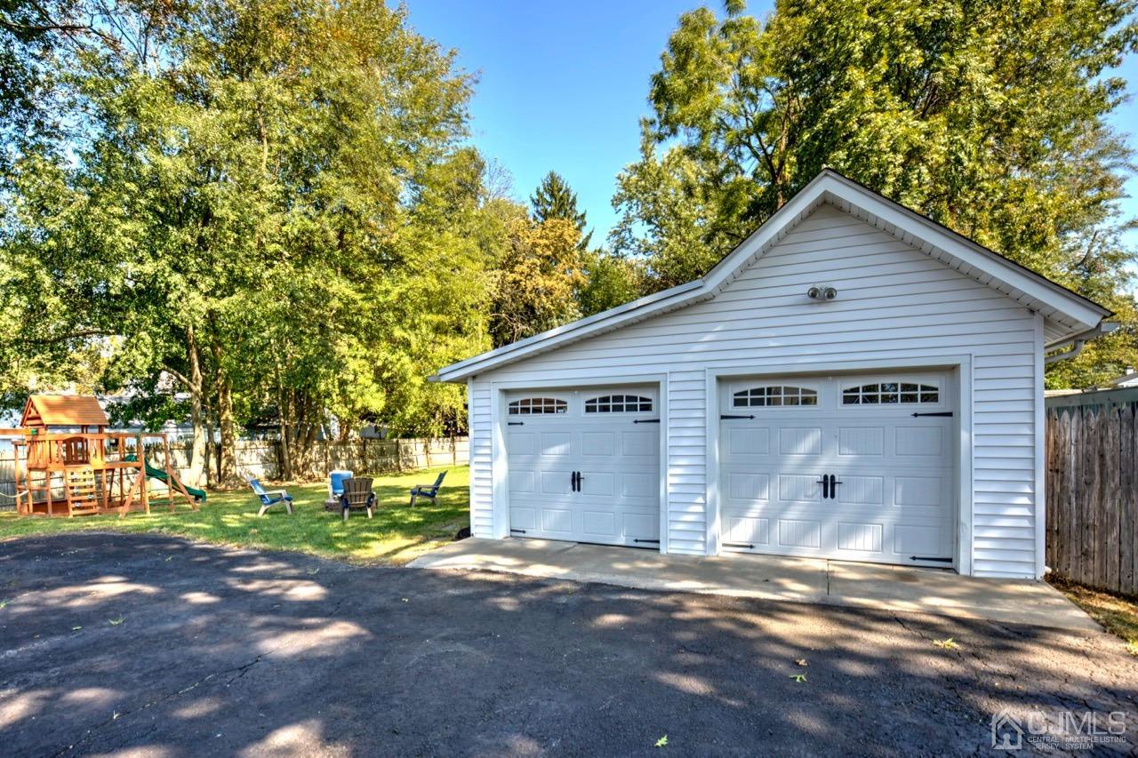 321 New Market Road Dunellen, NJ 08812 - Photo 22 of 31 a view of a house with a yard and garage