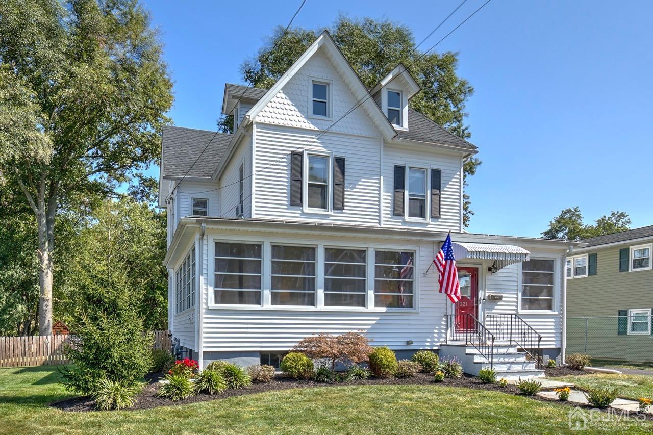 321 New Market Road Dunellen, NJ 08812 - Photo 4 of 31 a front view of a house with a yard