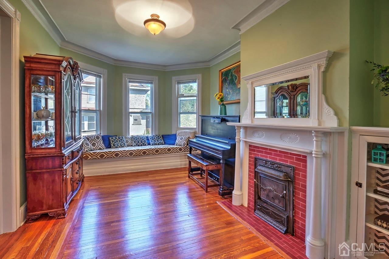 321 New Market Road Dunellen, NJ 08812 - Photo 7 of 31 a living room with furniture and a fireplace