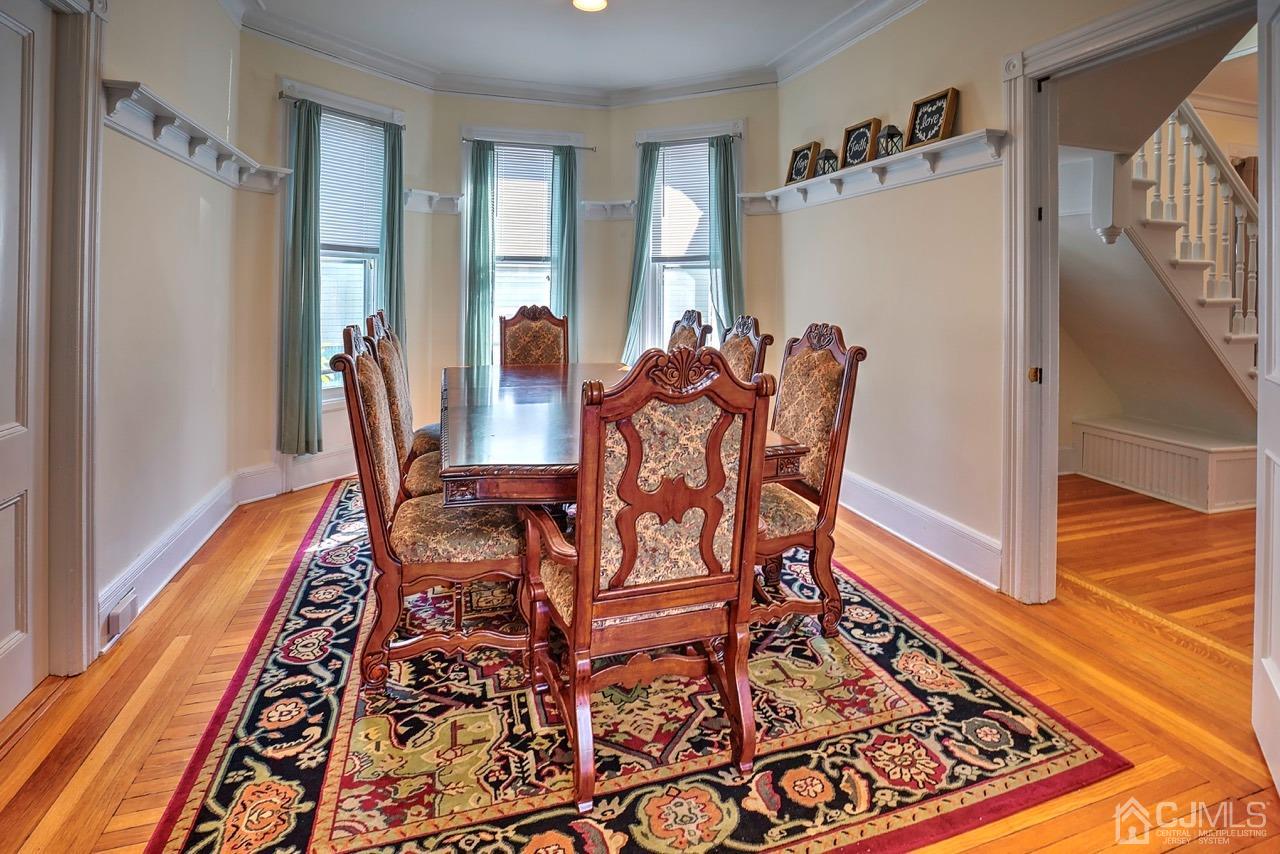 321 New Market Road Dunellen, NJ 08812 - Photo 9 of 31 a view of a dining room with furniture window and wooden floor