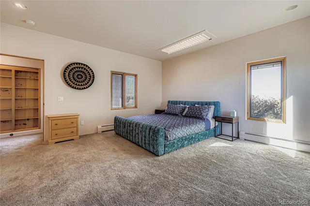 a bedroom with a bed and a table