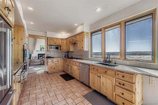 a large kitchen with a large window