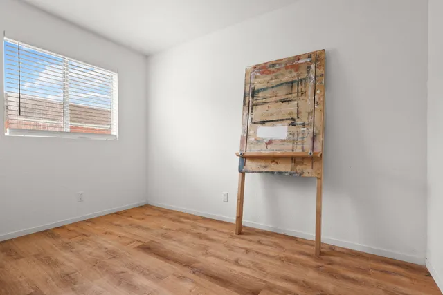 a view of an empty room with a closet