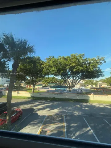 a view of a lake with a yard