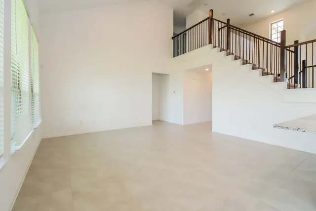 a view of a hallway with staircase