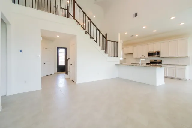a view of a kitchen with a sink cabinets and a window