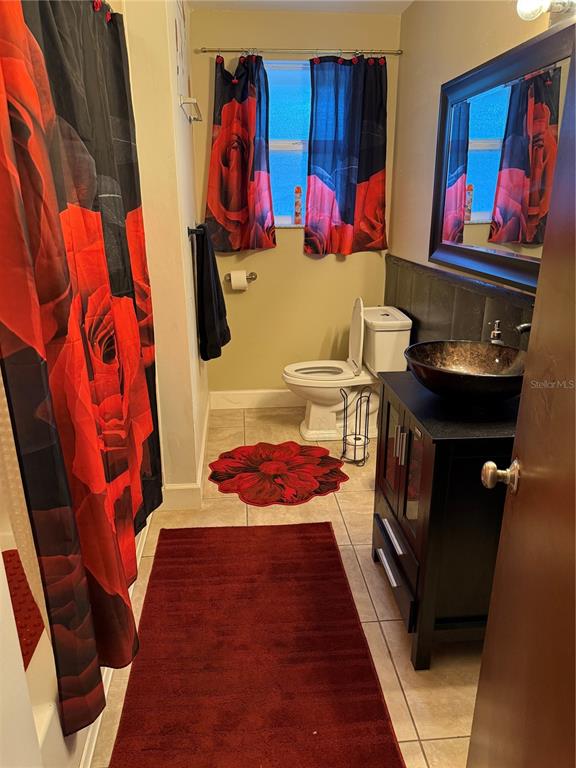 7713 Southwest 8th Avenue Gainesville, FL 32607 - Photo 17 of 32 a view of walk in closet with clothes and shoes