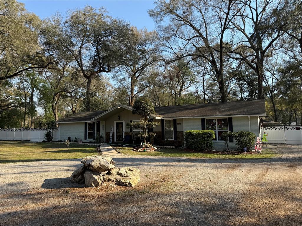 7713 Southwest 8th Avenue Gainesville, FL 32607 - Photo 31 of 32 a swimming pool view with a outdoor seating