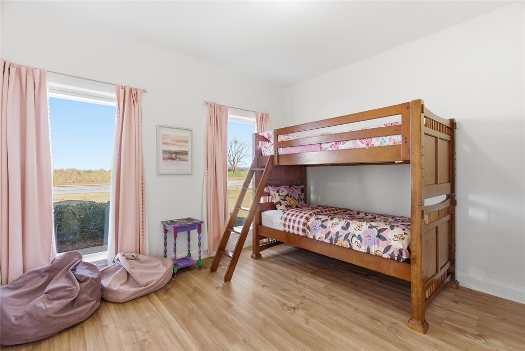 846 Old Tioga Road Gunter, TX 75058 - Photo 15 of 38 a bedroom with a bed and a window