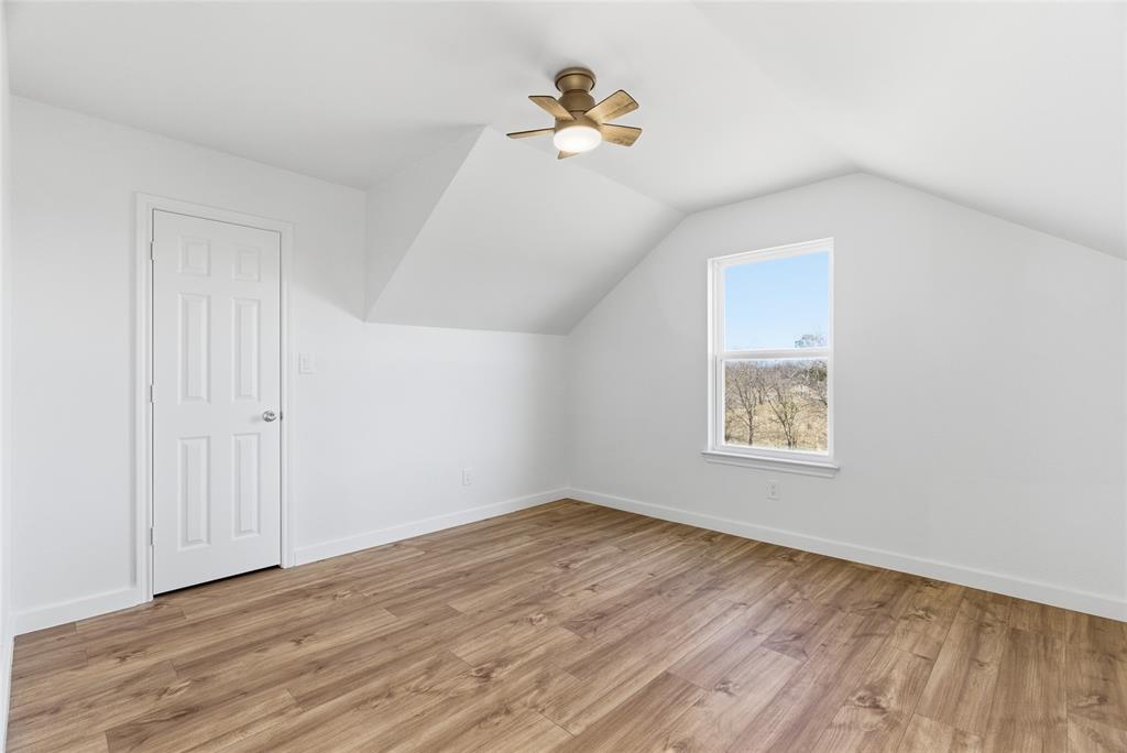 846 Old Tioga Road Gunter, TX 75058 - Photo 20 of 38 wooden floor in an empty room with a window