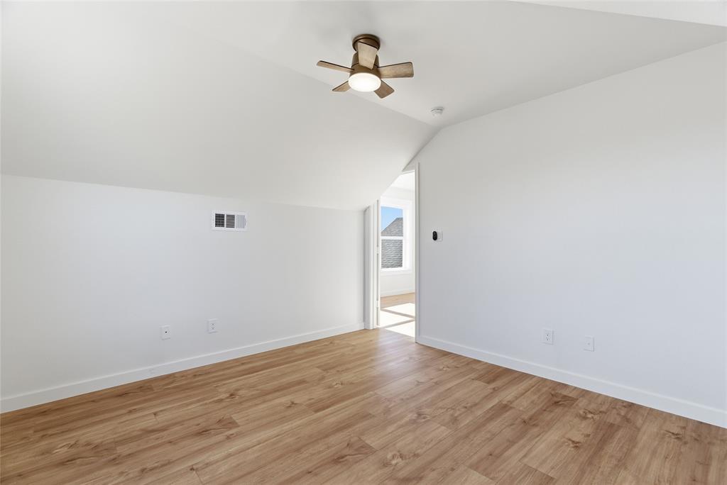 846 Old Tioga Road Gunter, TX 75058 - Photo 21 of 38 a view of a room with wooden floor and ceiling fan