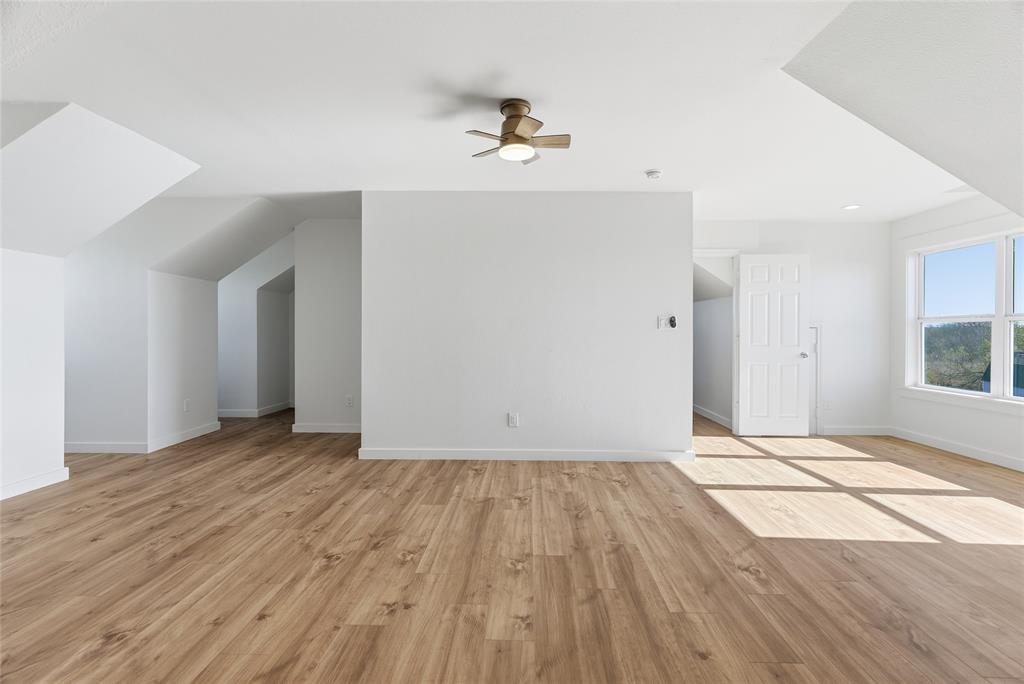 846 Old Tioga Road Gunter, TX 75058 - Photo 22 of 38 a view of an empty room and wooden floor