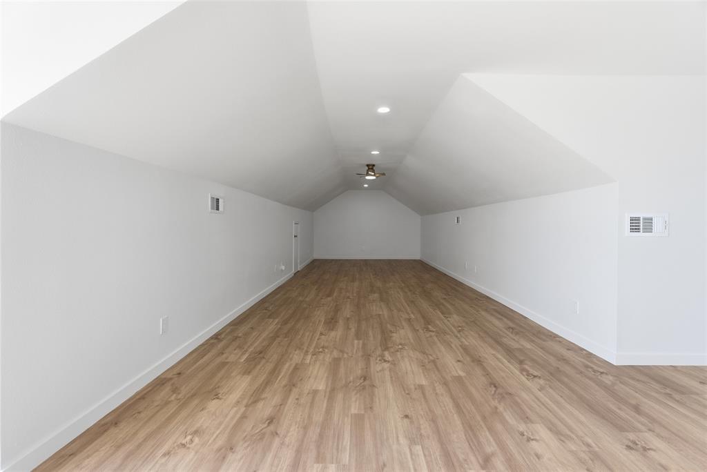 846 Old Tioga Road Gunter, TX 75058 - Photo 23 of 38 an empty room with wooden floor and windows
