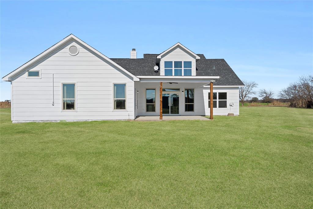 846 Old Tioga Road Gunter, TX 75058 - Photo 26 of 38 a view of a house with a yard