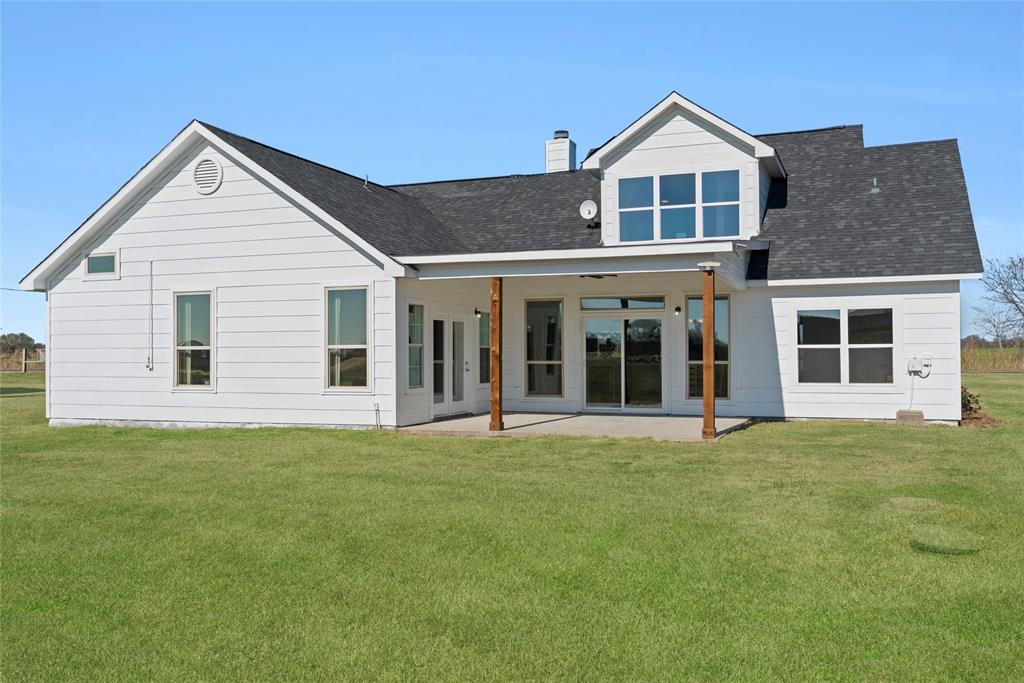 846 Old Tioga Road Gunter, TX 75058 - Photo 27 of 38 a big house with a big yard and large trees