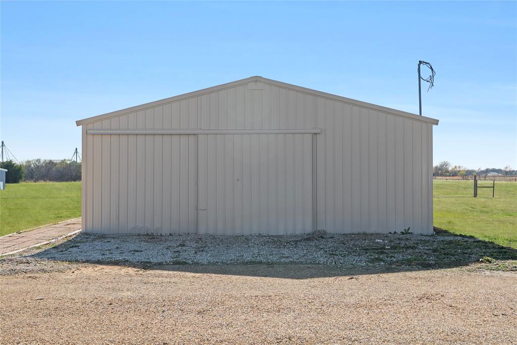 846 Old Tioga Road Gunter, TX 75058 - Photo 28 of 38 a wooden fence with a yard