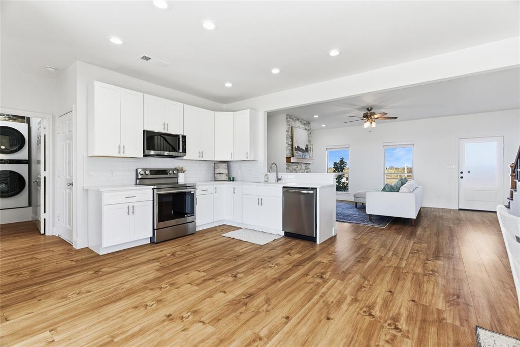 846 Old Tioga Road Gunter, TX 75058 - Photo 7 of 38 a view of kitchen with sink stainless steel appliances and cabinets