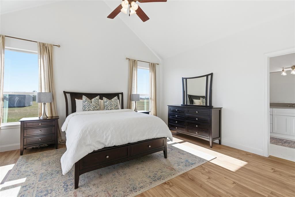 846 Old Tioga Road Gunter, TX 75058 - Photo 10 of 38 a bedroom with a bed and a dresser