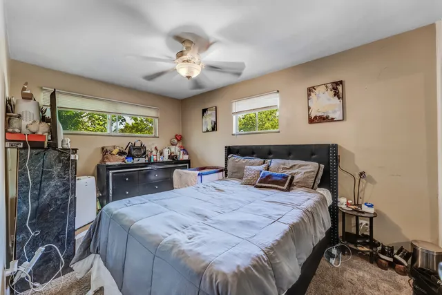 a bed room with a bed and a chandelier