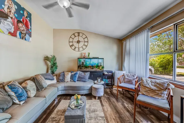 a living room with furniture and a large window