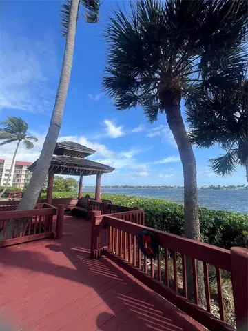 a view of a balcony with chairs