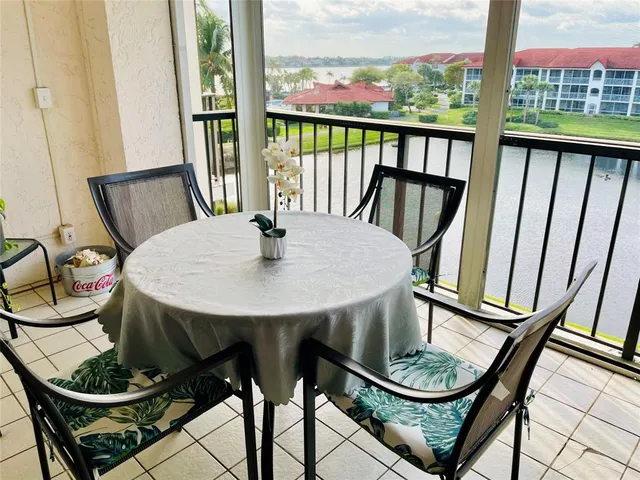 a view of a room with furniture and window