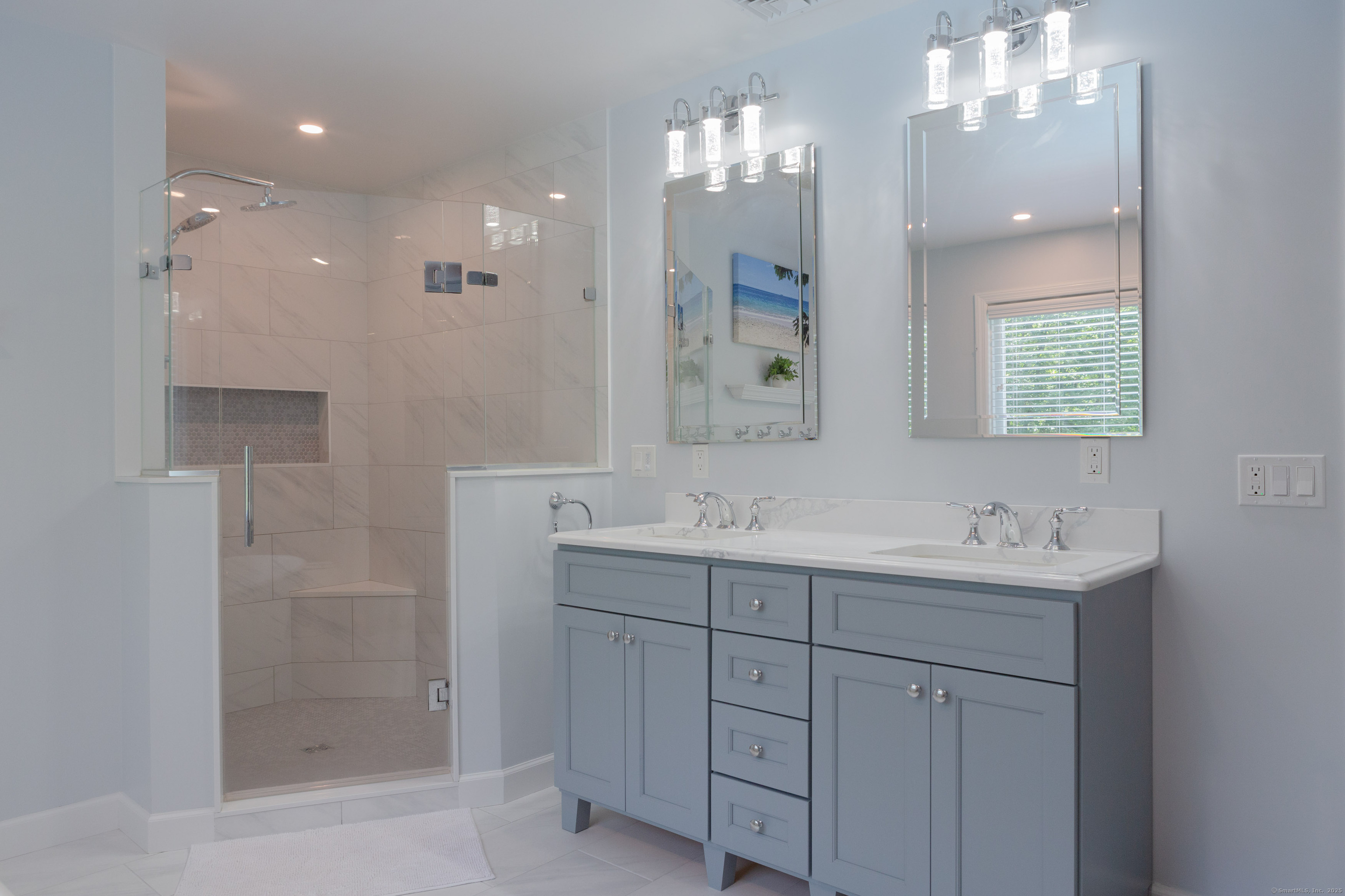 161 Foggwood Road Fairfield, CT 06824 - Photo 15 of 34 a bathroom with a sink a shower and a mirror