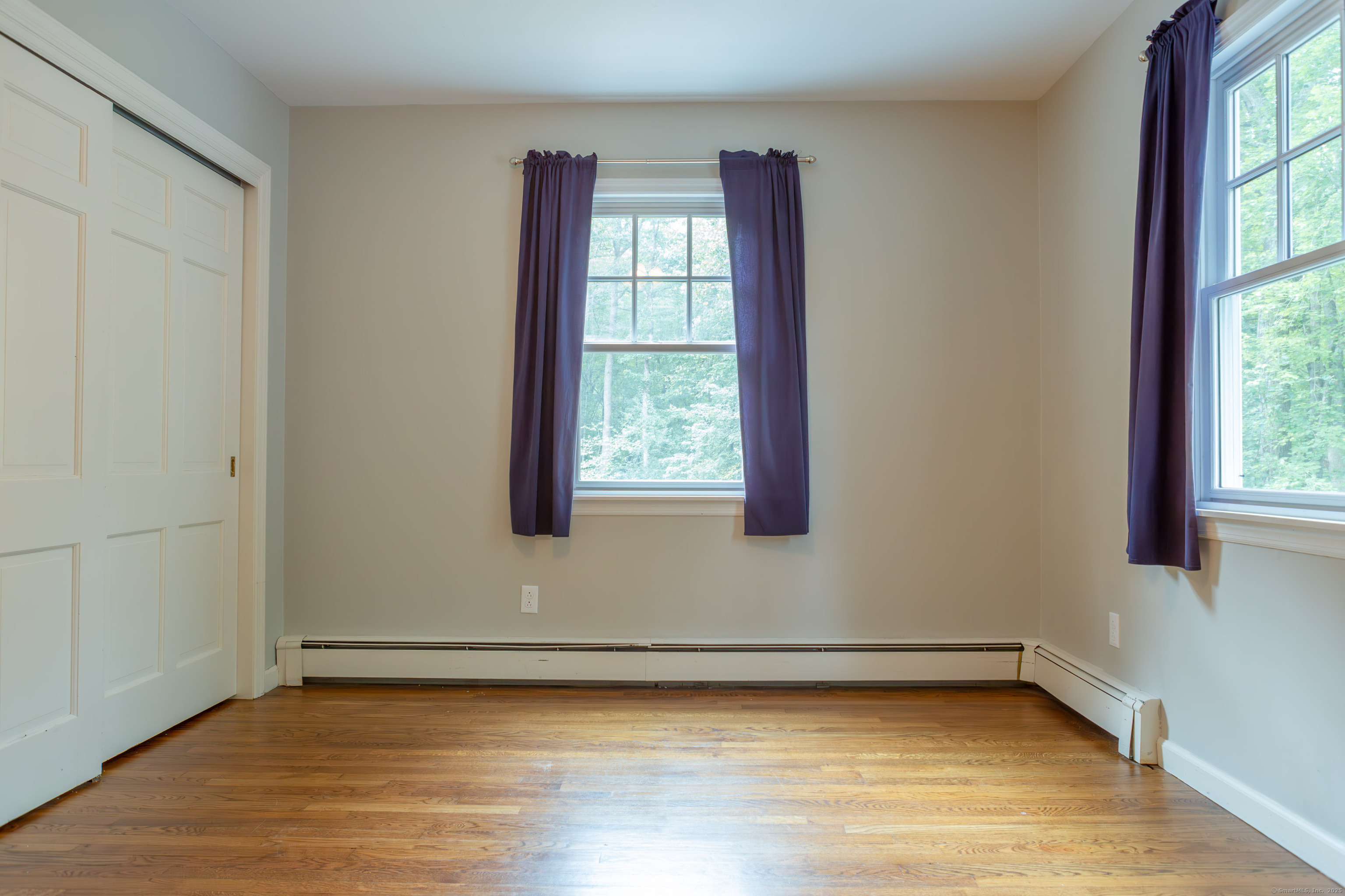 161 Foggwood Road Fairfield, CT 06824 - Photo 25 of 34 a view of a room with wooden floor and windows
