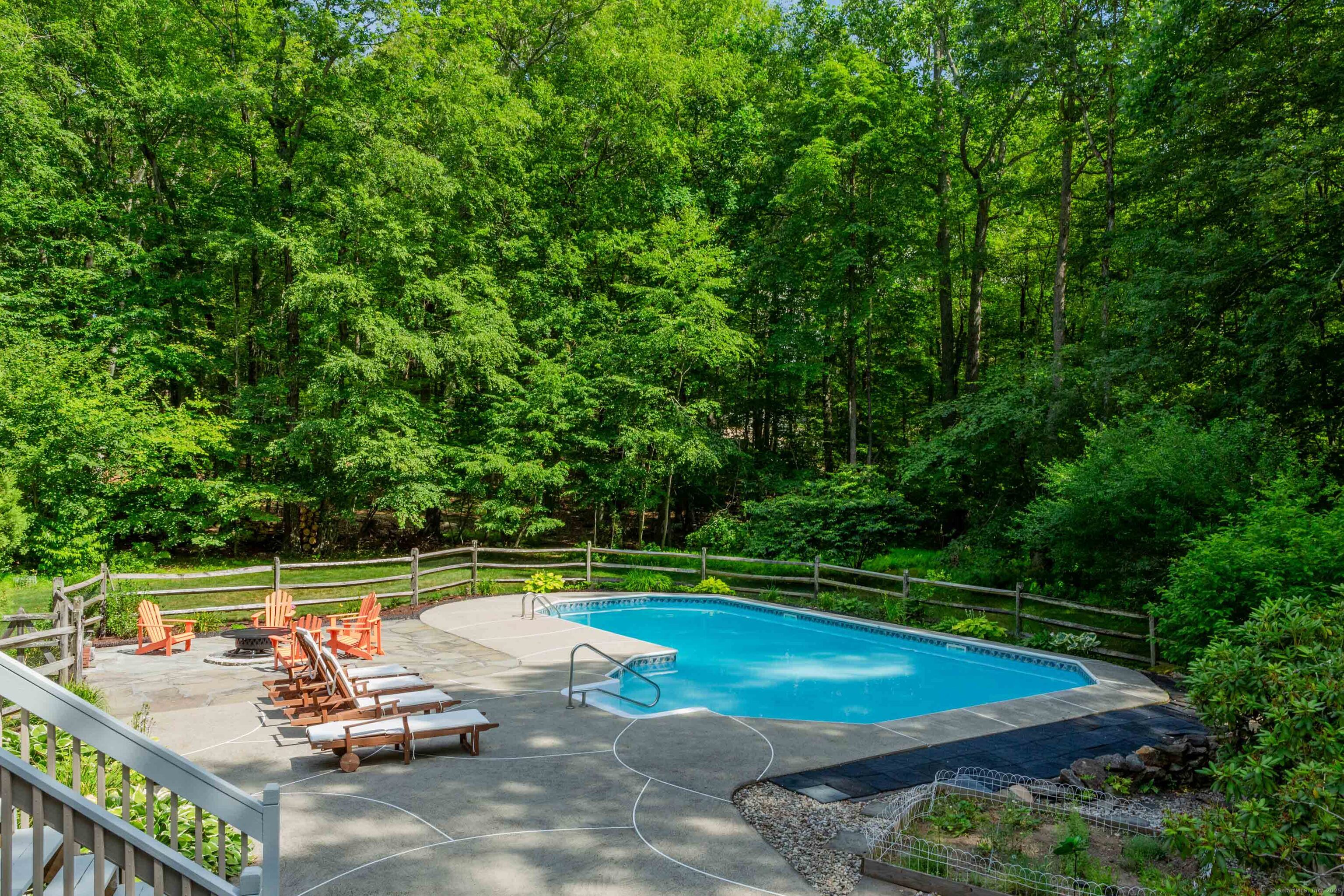 161 Foggwood Road Fairfield, CT 06824 - Photo 31 of 34 a view of a swimming pool with a patio