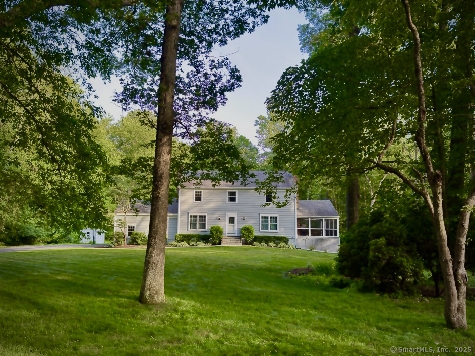161 Foggwood Road Fairfield, CT 06824 - Photo 34 of 34 a view of a house with a backyard
