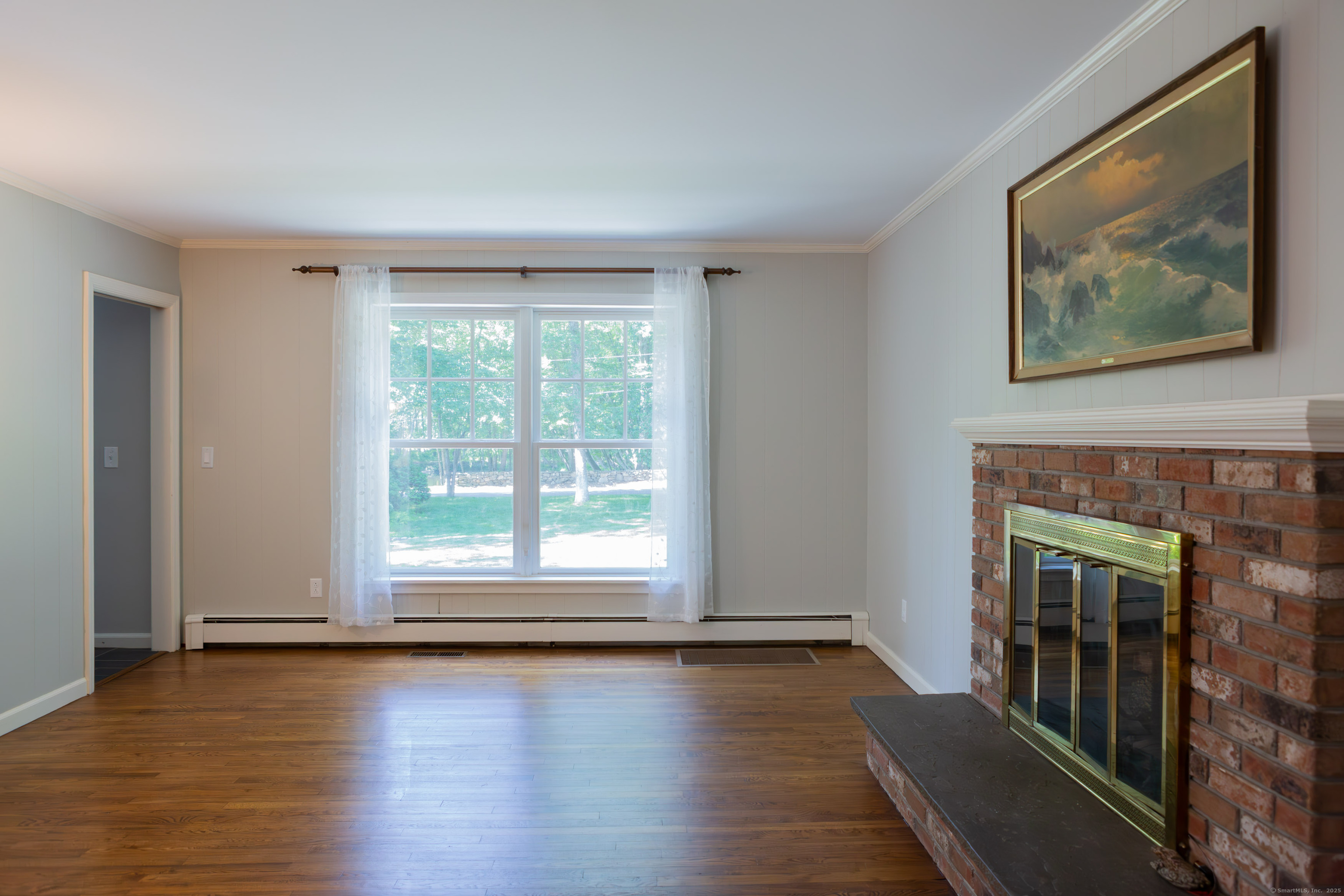 161 Foggwood Road Fairfield, CT 06824 - Photo 10 of 34 a view of a room with wooden floor and floor to ceiling window