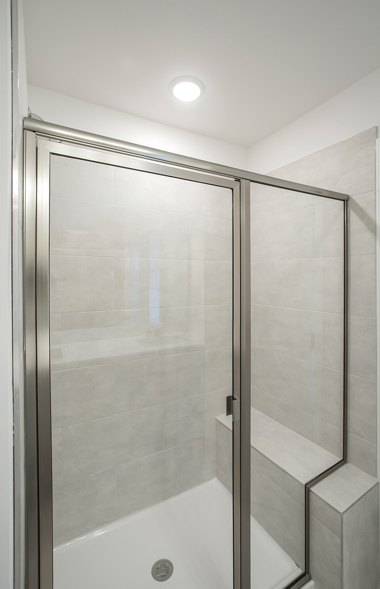 7159 Mapleside Lane Fairview, TN 37062 - Photo 11 of 38 a bathroom with a glass shower door