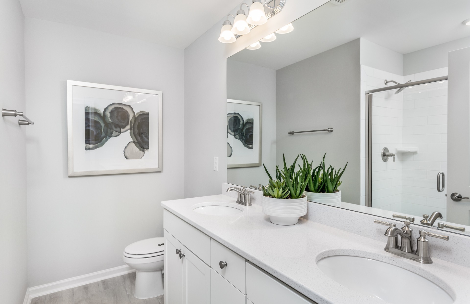 7159 Mapleside Lane Fairview, TN 37062 - Photo 25 of 38 a bathroom with a granite countertop sink a large mirror and a toilet