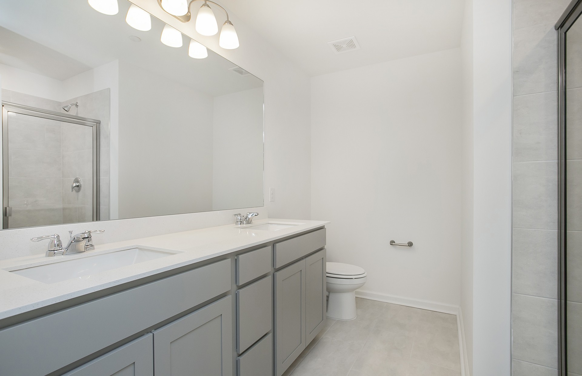 7159 Mapleside Lane Fairview, TN 37062 - Photo 10 of 38 a bathroom with a sink a toilet and a mirror