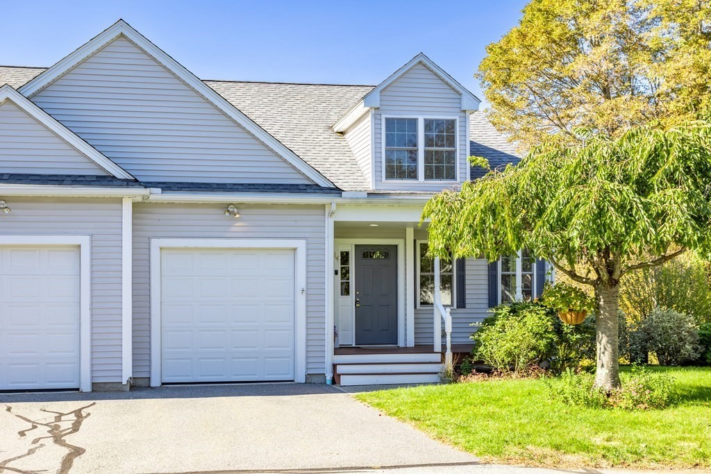 114 Summer Road, Unit 114 Boxborough, MA 01719 - Photo 2 of 42 a view of a house that has a small garden