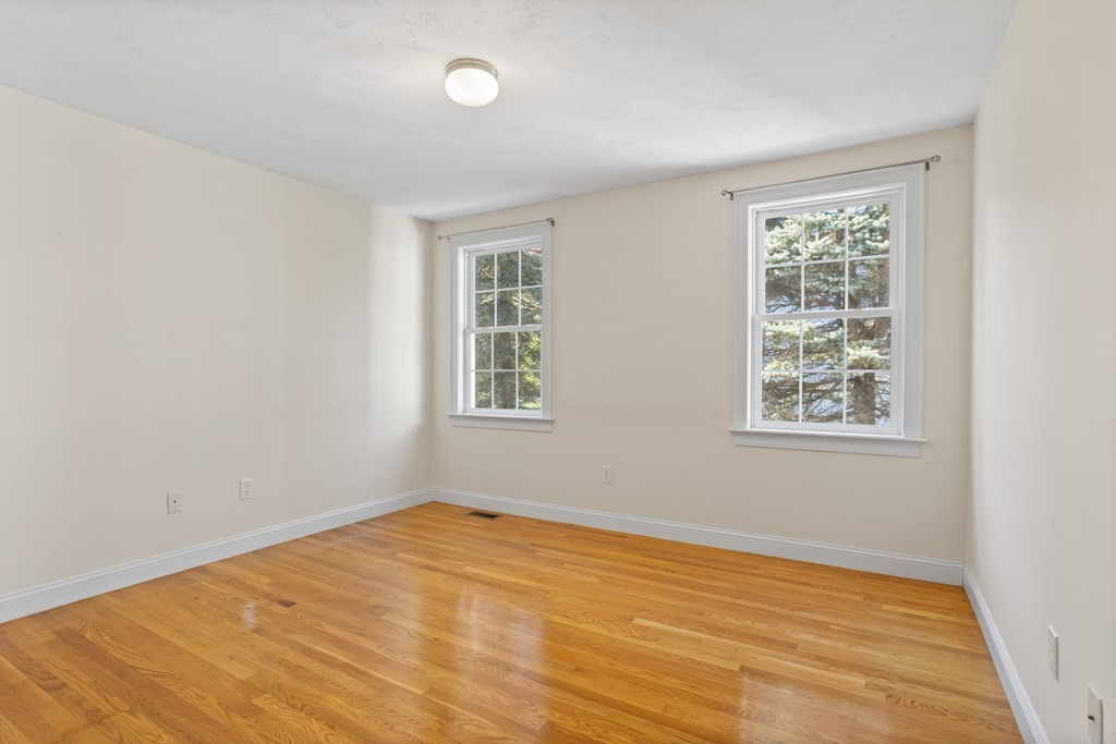 114 Summer Road, Unit 114 Boxborough, MA 01719 - Photo 26 of 42 a view of an empty room with a window