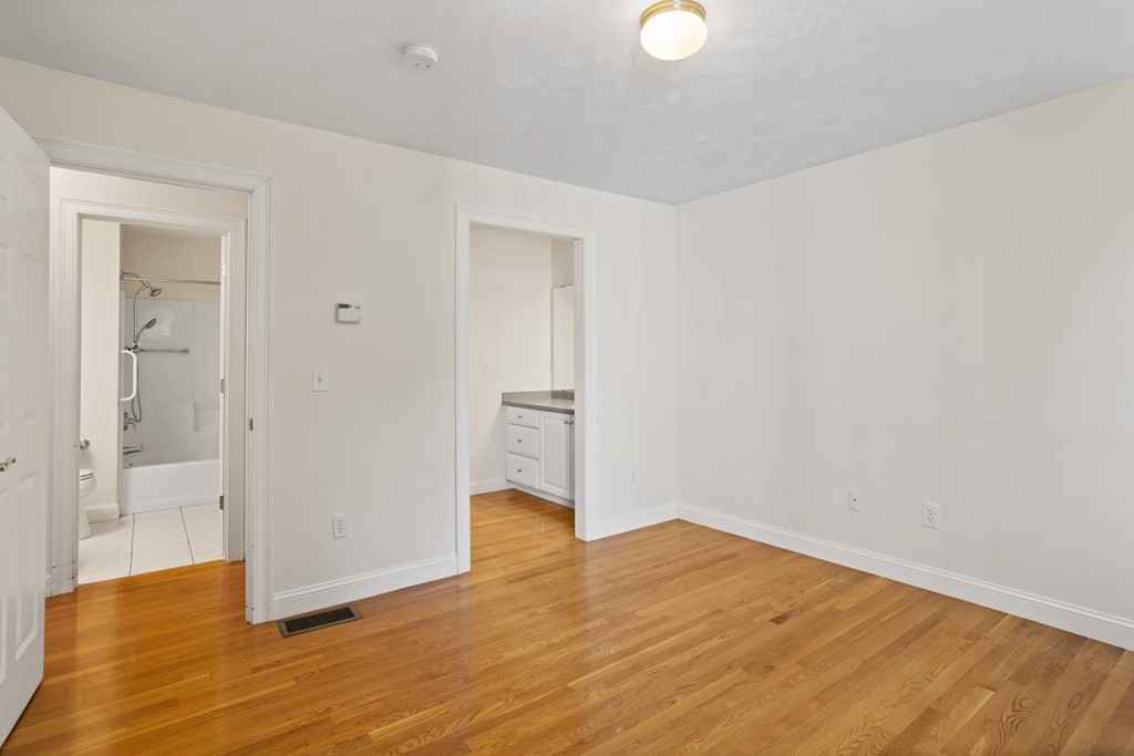 114 Summer Road, Unit 114 Boxborough, MA 01719 - Photo 29 of 42 a view of empty room with wooden floor