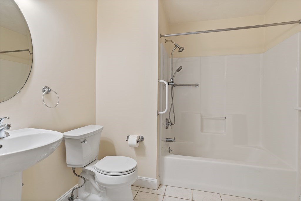 114 Summer Road, Unit 114 Boxborough, MA 01719 - Photo 31 of 42 a bathroom with a toilet and a bathtub
