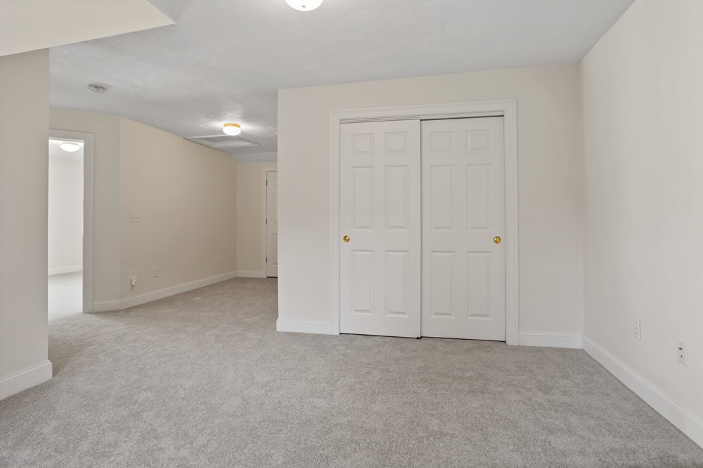 114 Summer Road, Unit 114 Boxborough, MA 01719 - Photo 36 of 42 a view of an empty room