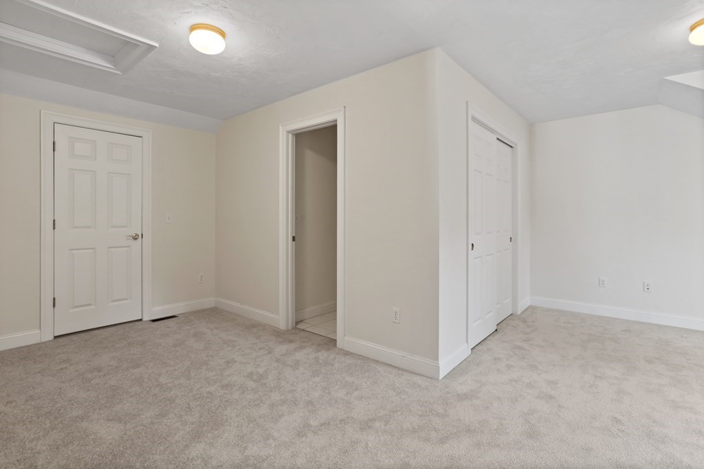 114 Summer Road, Unit 114 Boxborough, MA 01719 - Photo 37 of 42 an empty room with closet