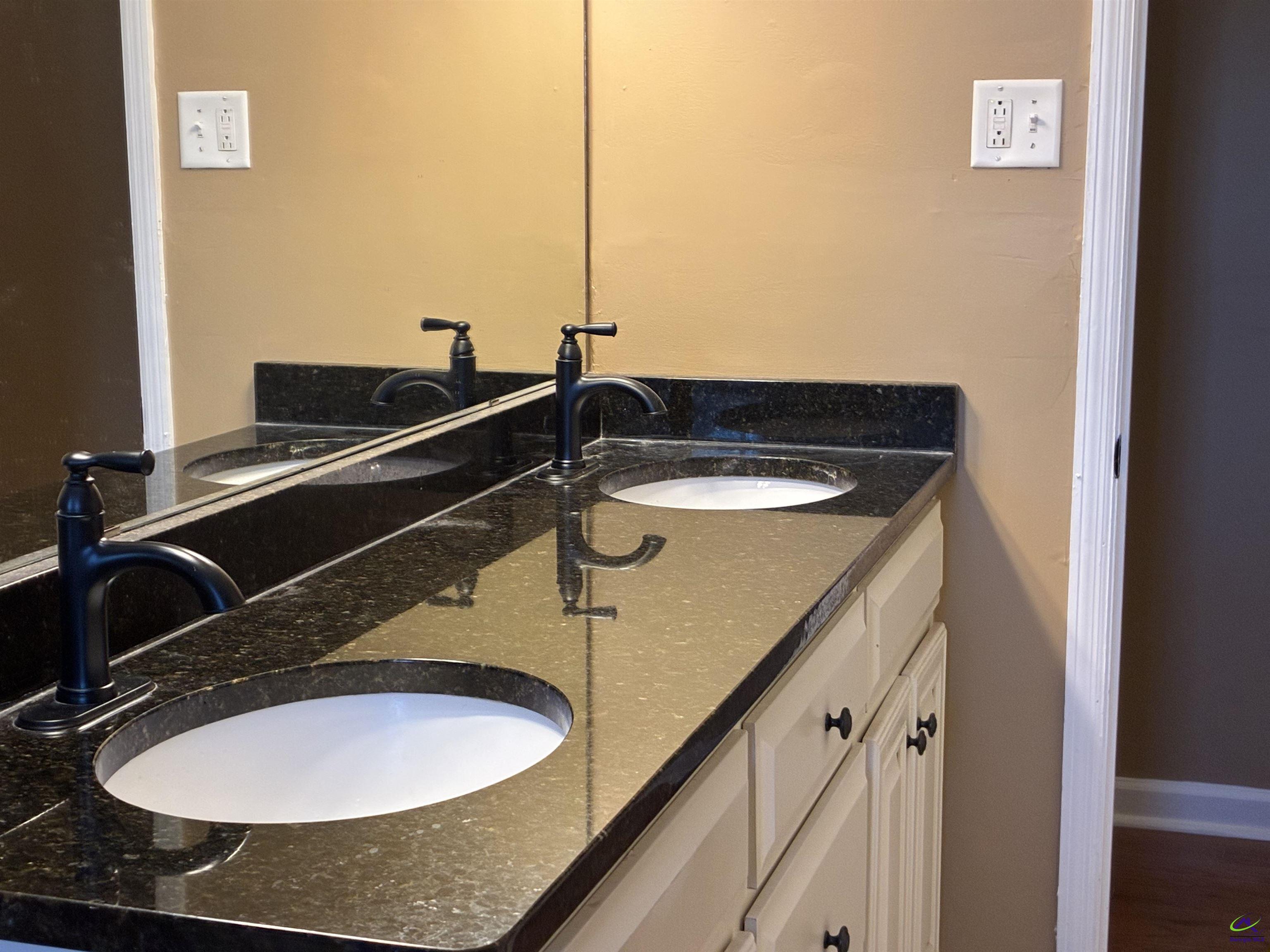 3491 Sandy Circle Macon, GA 31216 - Photo 26 of 47 a bathroom with a sink and a mirror