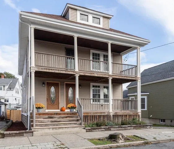 a front view of a house with stairs