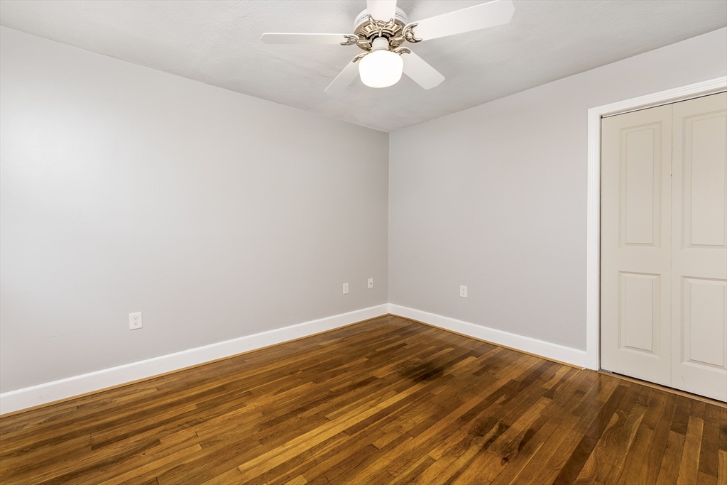 22 Clovelly Street Lynn, MA 01902 - Photo 12 of 28 a view of an empty room with wooden floor