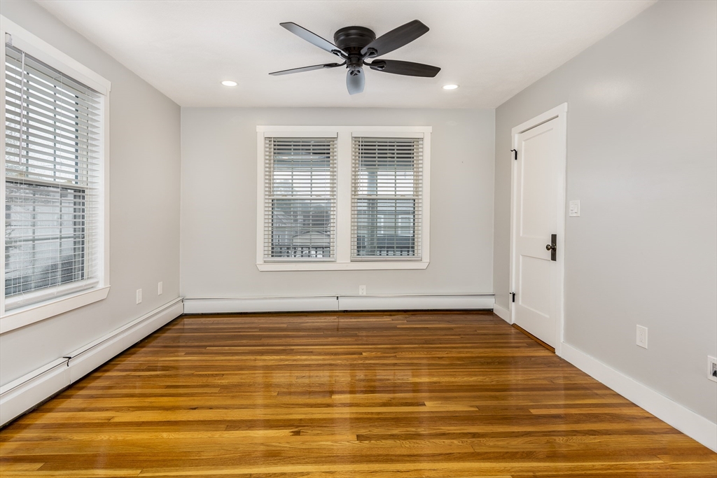 22 Clovelly Street Lynn, MA 01902 - Photo 14 of 28 a view of a livingroom with a ceiling fan and window