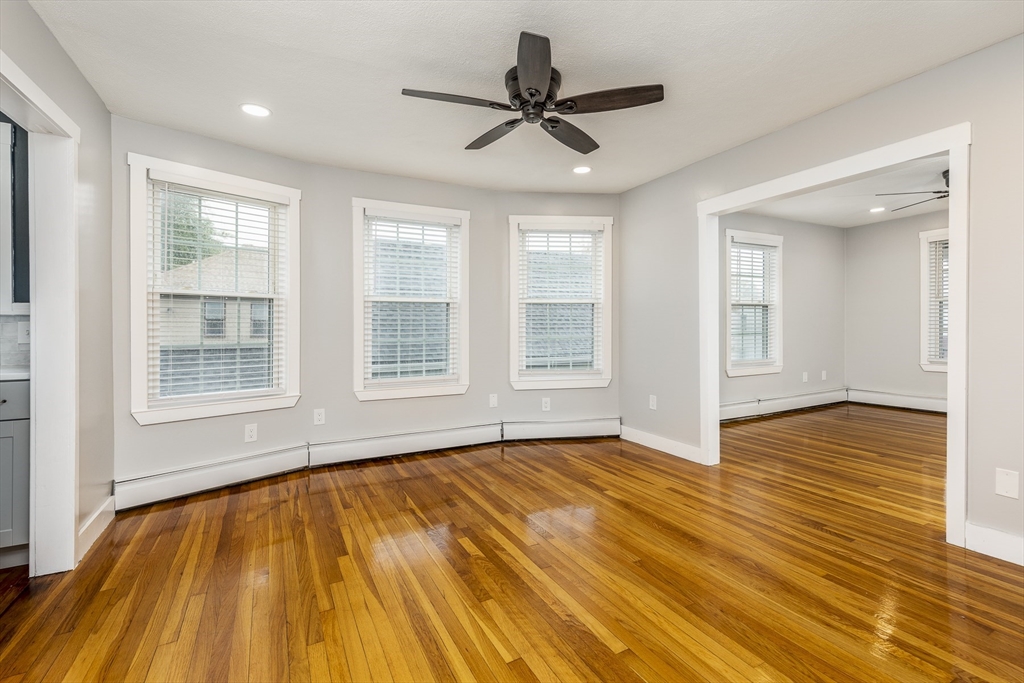 22 Clovelly Street Lynn, MA 01902 - Photo 18 of 28 a view of empty room with wooden floor and fan