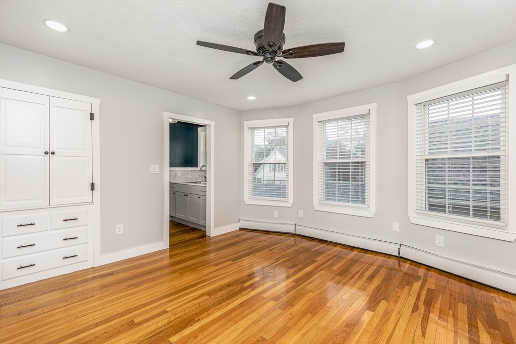 22 Clovelly Street Lynn, MA 01902 - Photo 19 of 28 a view of an empty room with a window and wooden floor