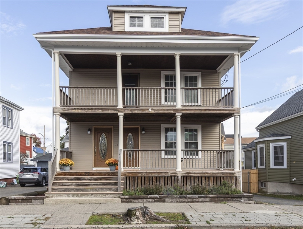 22 Clovelly Street Lynn, MA 01902 - Photo 2 of 28 a view of a house with more windows and a tree