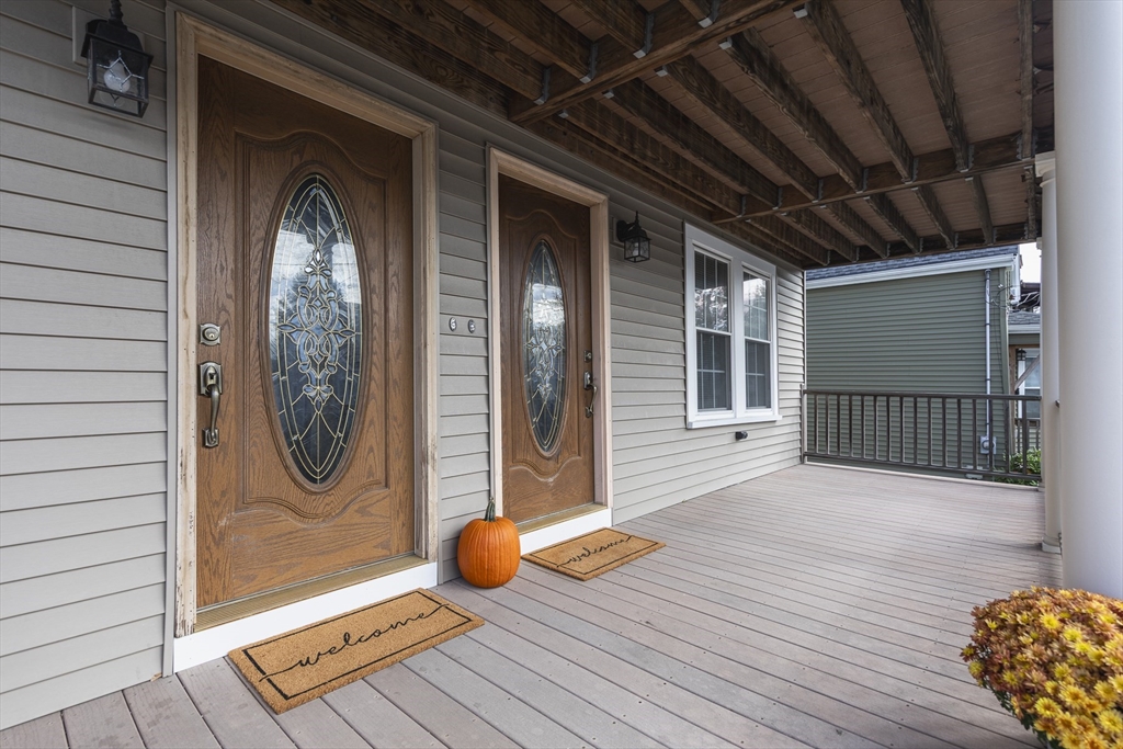22 Clovelly Street Lynn, MA 01902 - Photo 3 of 28 a view of a hallway with wooden floor and a glass door