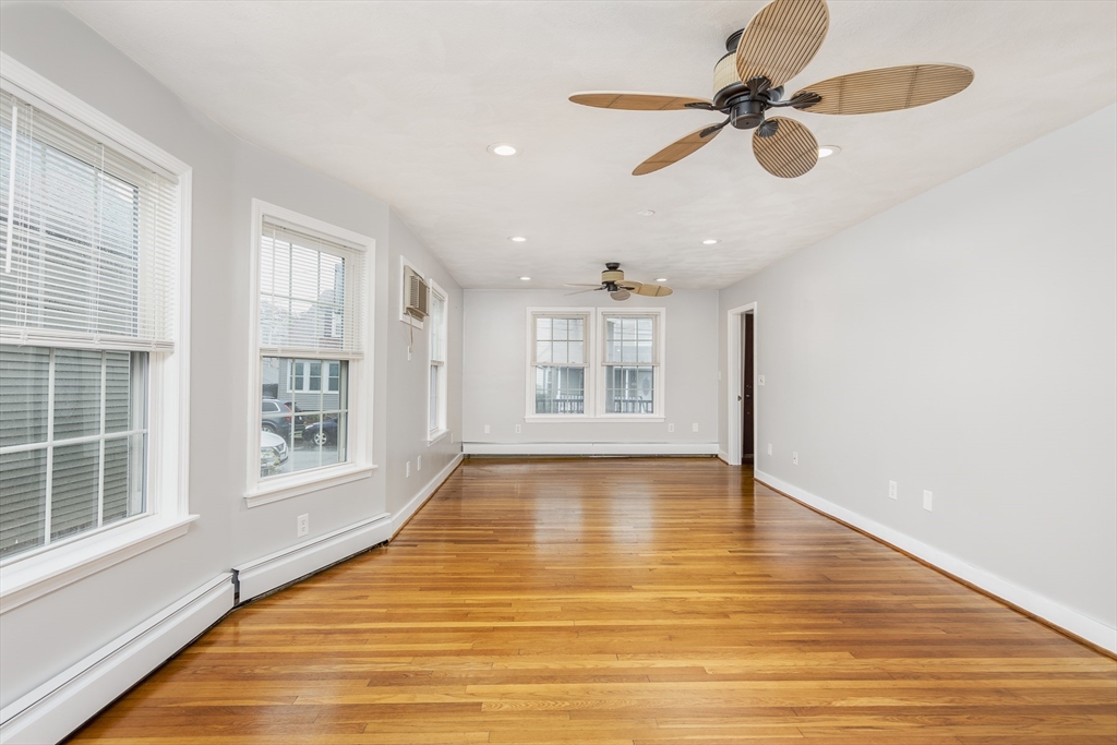 22 Clovelly Street Lynn, MA 01902 - Photo 4 of 28 a view of an empty room with a window and wooden floor
