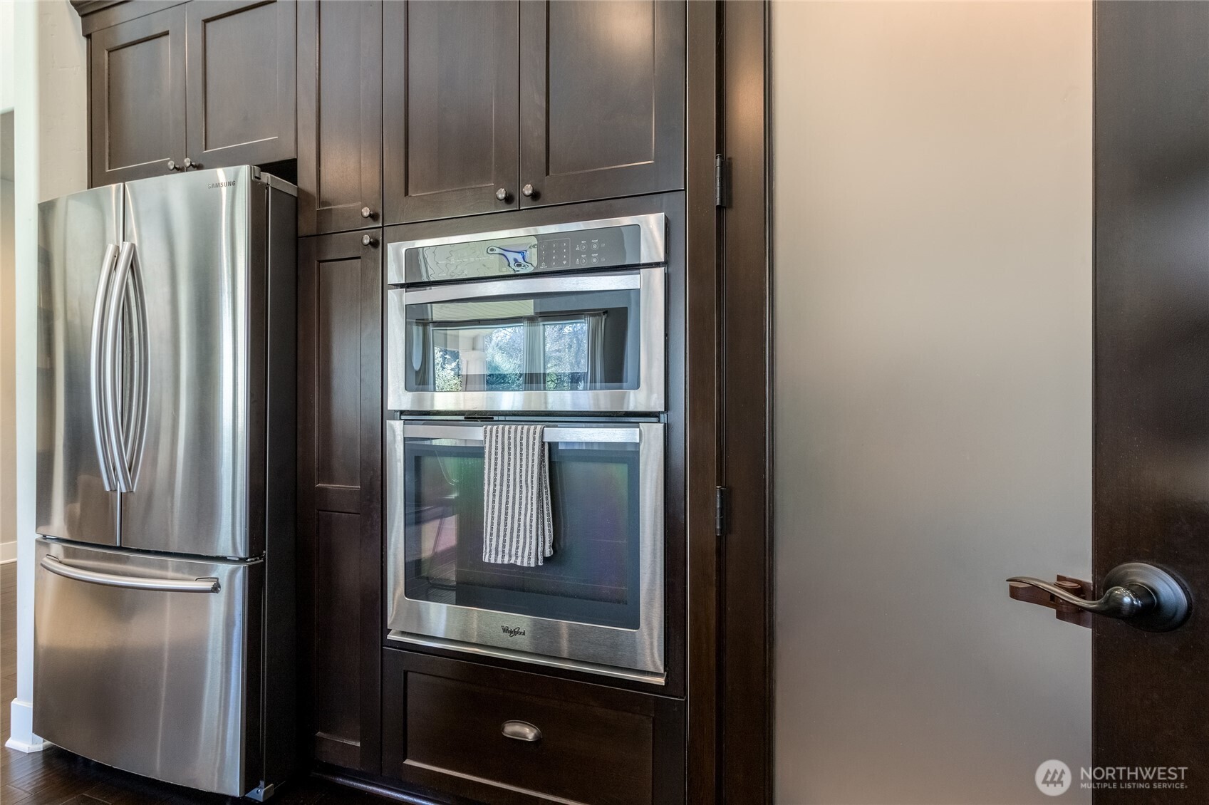 341 Reserve Way Walla Walla, WA 99362 - Photo 12 of 40 a kitchen with metallic refrigerator freezer and a dishwasher